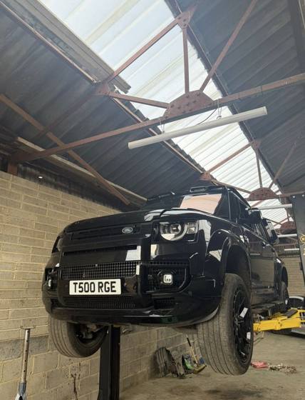 Land Rover Defender on the ramp for servicing in Medway