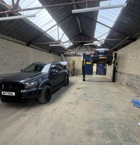 Two post ramp inside the Elite Mechanics workshop in Kent
